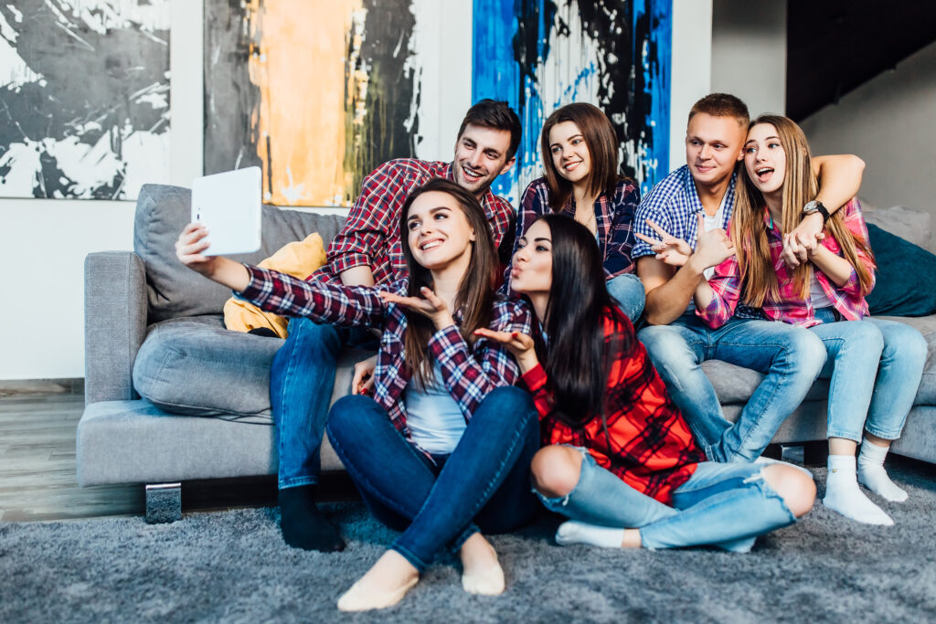 group funny young friends sitting home sofa making selfie together 1